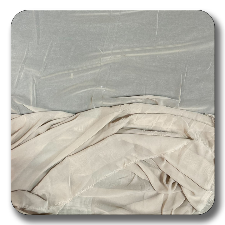 High-quality polyester chiffon fabric in soft, lightweight texture, perfect for versatile sewing projects and elegant drapes.