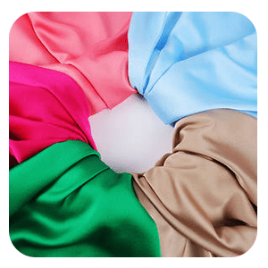 Colorful polyester chiffon fabric swatches in pink, blue, green and tan, showcasing softness and versatility.
