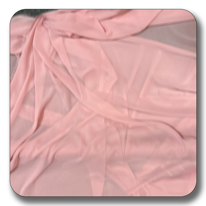 Soft pink polyester chiffon fabric, lightweight and durable, perfect for various creative projects.