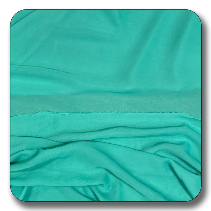 Soft teal polyester chiffon fabric with a smooth, lightweight texture, perfect for versatile sewing projects.