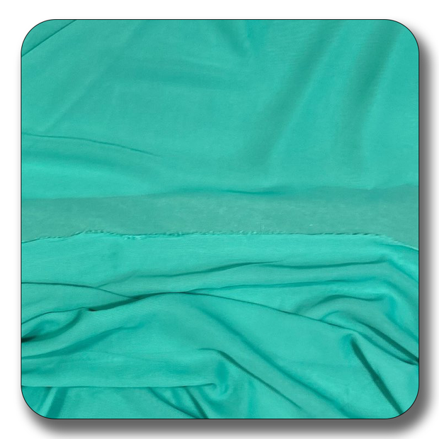 Soft teal polyester chiffon fabric with a smooth, lightweight texture, perfect for versatile sewing projects.