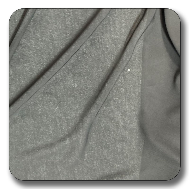 Close-up of soft gray polyester chiffon fabric, showcasing its smooth texture and lightweight quality.