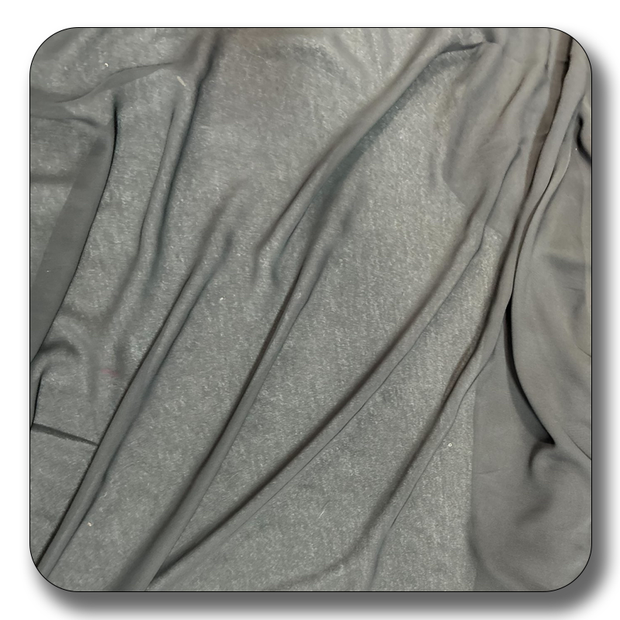Soft polyester chiffon fabric in black, showcasing its lightweight and durable texture, ideal for various sewing projects.