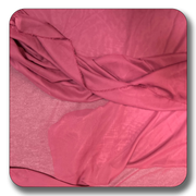 Soft pink chiffon fabric made of 100% polyester, lightweight and durable, ideal for various sewing projects.