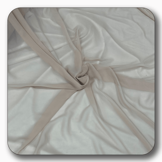 Soft polyester chiffon fabric in a creamy beige color, showcasing its lightweight and durable texture.