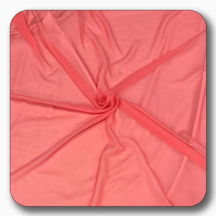 High-quality 100% soft polyester chiffon fabric in coral color, lightweight and versatile, sold by the yard.