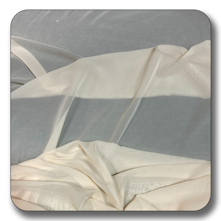 Soft, lightweight polyester chiffon fabric in cream color, perfect for sewing projects and versatile designs.