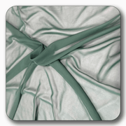 Close-up of soft polyester chiffon fabric in light green, showcasing its smooth texture and elegant drape.