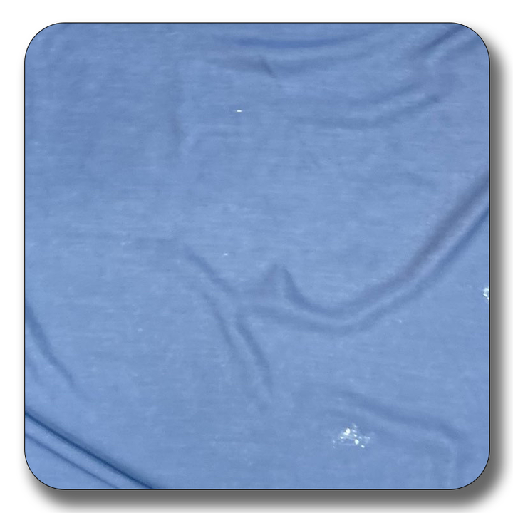 Close-up of blue polyester chiffon fabric, showcasing its soft texture and lightweight quality, ideal for versatile sewing projects.