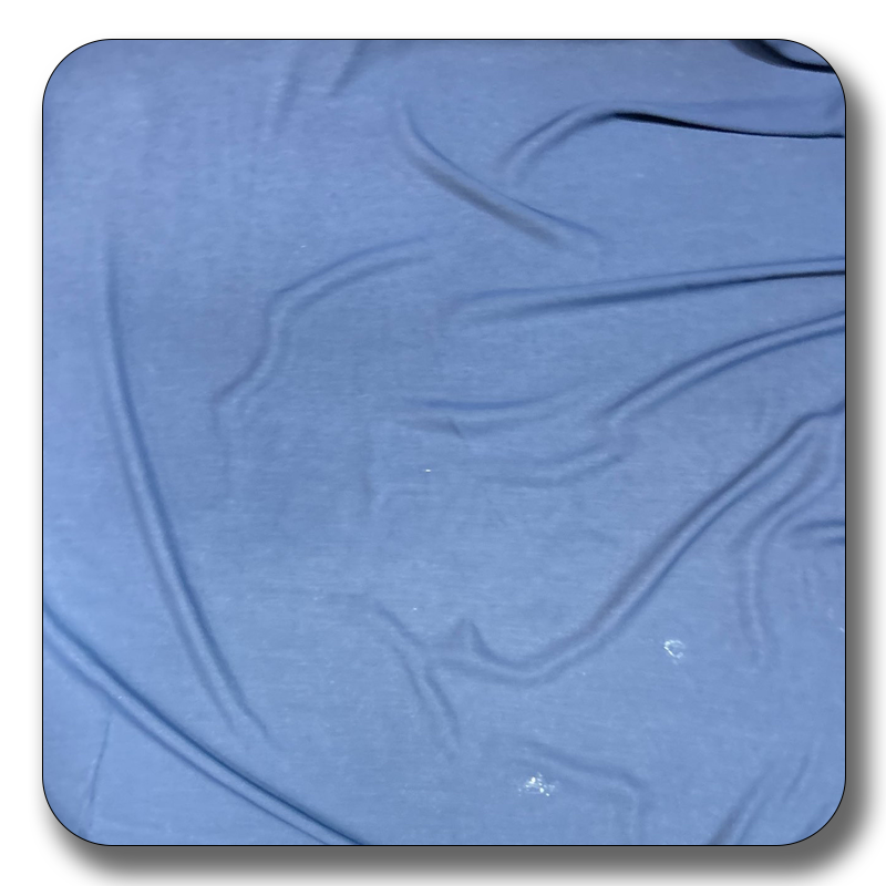 Soft polyester chiffon fabric in rich blue color, showcasing its lightweight and durable texture, perfect for sewing projects.