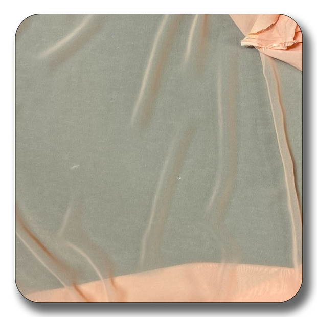 Close-up of lightweight polyester chiffon fabric in soft peach and green hues, perfect for versatile crafting projects.
