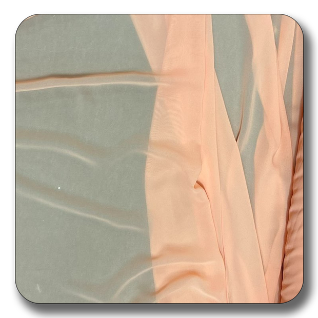Soft peach polyester chiffon fabric showcasing its lightweight and crease-resistant qualities.